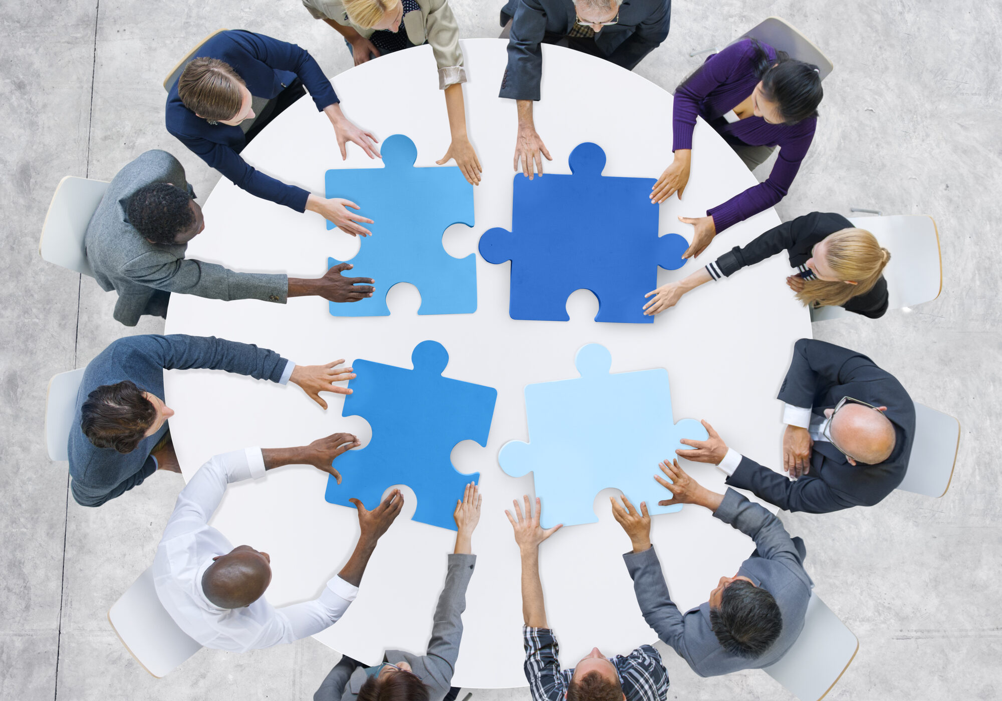 Business People and Jigsaw Puzzle Pieces